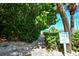 Lush path leads to private beach access for owners and guests at 105 Casey Key Rd # 20, Nokomis, FL 34275