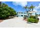 La Siesta Beach Retreat features colorful beachside buildings with tropical landscaping and beach access at 105 Casey Key Rd # 20, Nokomis, FL 34275