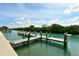 Private boat dock on tranquil waters offering serene waterfront living with beautiful surrounding nature at 105 Casey Key Rd # 20, Nokomis, FL 34275