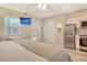 Bright studio with a bed, kitchenette, dining table, and easy access to the outdoors at 105 Casey Key Rd # 20, Nokomis, FL 34275