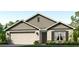 Inviting single-story home with a two-car garage, shuttered window, and charming landscaping at 10837 Gentle Current Way, Parrish, FL 34219