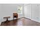 Bedroom featuring tile flooring, a window, and a small writing desk at 10926 Sand Pine Ln, Parrish, FL 34219