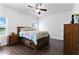 Bright bedroom with hard surface floors and bright sunny windows with a view of the lake at 10926 Sand Pine Ln, Parrish, FL 34219
