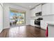 Modern kitchen with stainless steel appliances and a sliding glass door overlooking the water at 10926 Sand Pine Ln, Parrish, FL 34219
