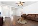 Inviting living room boasting sleek wood-look tile flooring and white walls at 10926 Sand Pine Ln, Parrish, FL 34219