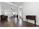 Spacious living area with wood-look tile flooring and an open concept design at 10926 Sand Pine Ln, Parrish, FL 34219