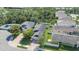 Aerial view of a home in a neighborhood with fenced yards and mature trees and landscaping at 110 San Lorenzo Ct, Bradenton, FL 34208