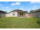 Backyard featuring a pergola with an outdoor patio with views of lush green grass at 110 San Lorenzo Ct, Bradenton, FL 34208