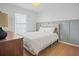 Cozy bedroom features wainscotting, wood floors, and a comfortable bed at 110 San Lorenzo Ct, Bradenton, FL 34208