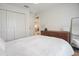 Bright bedroom featuring wood floors, closet, and a dresser with a mirror at 110 San Lorenzo Ct, Bradenton, FL 34208
