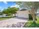 Charming single-Gathering home with a brick driveway, lush landscaping, and an attached two-car garage at 110 San Lorenzo Ct, Bradenton, FL 34208