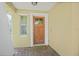 Front porch view of the house with the brick flooring, and a wooden door with a window at 110 San Lorenzo Ct, Bradenton, FL 34208