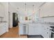 Kitchen with stainless steel appliances, marble countertops, and an open view at 110 San Lorenzo Ct, Bradenton, FL 34208