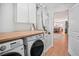 Modern laundry area equipped with wooden countertop and new front load laundry machines at 110 San Lorenzo Ct, Bradenton, FL 34208