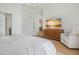 Main bedroom featuring wood-look floors and a sunset view on the TV at 110 San Lorenzo Ct, Bradenton, FL 34208