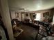A living room featuring hardwood floors, a ceiling fan, and comfortable leather furniture at 1113 23Rd W Ave, Bradenton, FL 34205