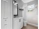 Bathroom featuring a white vanity with dark hardware, a walk-in shower, and tile flooring at 11410 57Th E St, Parrish, FL 34219