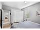 Comfortable bedroom featuring a light blue bedspread, a double door closet, and a window with blinds at 11410 57Th E St, Parrish, FL 34219