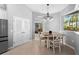 Bright dining area next to the kitchen with a table and chairs, offering a view to the outside at 11410 57Th E St, Parrish, FL 34219