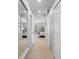 Hallway leading to the bedrooms showcasing neutral tones and plenty of natural light at 11410 57Th E St, Parrish, FL 34219