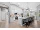 Modern kitchen featuring white cabinetry, stainless steel appliances, and a spacious center island with bar seating at 11410 57Th E St, Parrish, FL 34219