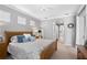 Neutral main bedroom with a tray ceiling, carpet, and large windows for natural light at 11410 57Th E St, Parrish, FL 34219