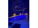 Screened in pool and patio with a barbecue/fireplace, elegant lighting, and water feature at 11410 57Th E St, Parrish, FL 34219