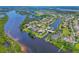 Waterfront homes with private docks and swimming pools, offer serene living in this aerial neighborhood view at 11807 Rive Isle Run, Parrish, FL 34219