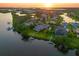 Breathtaking aerial view of waterfront property with lush landscaping and convenient boat access at 11807 Rive Isle Run, Parrish, FL 34219