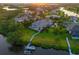 Aerial view of the property showcasing lush landscaping, a pool, and access to the waterway at 11807 Rive Isle Run, Parrish, FL 34219
