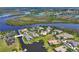 An aerial view shows waterfront homes with private docks along a serene waterway at 11807 Rive Isle Run, Parrish, FL 34219
