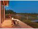 Charming backyard with a cozy fire pit and tranquil water view at 11807 Rive Isle Run, Parrish, FL 34219
