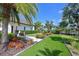 Lush backyard with manicured landscaping and mini golf at 11807 Rive Isle Run, Parrish, FL 34219