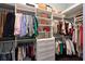 Well-organized walk-in closet with custom shelving and ample storage for clothing and accessories at 11807 Rive Isle Run, Parrish, FL 34219