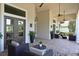 Charming covered patio featuring cozy seating arrangements, decorative plants, and stylish accents for relaxation at 11807 Rive Isle Run, Parrish, FL 34219