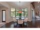 Bright dining area with large windows overlooking the pool and outdoor space at 11807 Rive Isle Run, Parrish, FL 34219