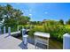 Dock featuring a convenient fish cleaning station by the water at 11807 Rive Isle Run, Parrish, FL 34219