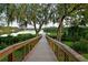 Peaceful wooden dock with serene water views, perfect for enjoying nature and relaxation in a picturesque setting at 11807 Rive Isle Run, Parrish, FL 34219