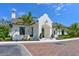 Stunning white home exterior with manicured landscaping and tile roof at 11807 Rive Isle Run, Parrish, FL 34219
