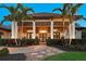 Beautiful home with manicured landscaping, rock pathway, and an inviting front facade at 11807 Rive Isle Run, Parrish, FL 34219
