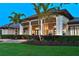 Elegant home with manicured landscaping, stone walkway, and an inviting front facade at 11807 Rive Isle Run, Parrish, FL 34219