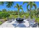 Inviting outdoor fire pit area with comfortable seating, perfect for entertaining and enjoying the natural surroundings at 11807 Rive Isle Run, Parrish, FL 34219