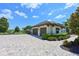 Beautiful three car garage with a paver driveway and well manicured landscaping at 11807 Rive Isle Run, Parrish, FL 34219
