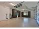 Spacious garage with epoxy floor, custom cabinetry, and automated door system at 11807 Rive Isle Run, Parrish, FL 34219
