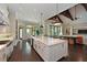 Bright, open kitchen featuring a large island and seamlessly connecting to the living area at 11807 Rive Isle Run, Parrish, FL 34219