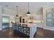 Gourmet kitchen featuring stainless steel appliances and a large island with bar seating at 11807 Rive Isle Run, Parrish, FL 34219
