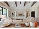 Spacious living room featuring high ceilings, wooden beams, and a large entertainment center at 11807 Rive Isle Run, Parrish, FL 34219