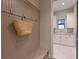 Charming mudroom entry with hooks and storage next to a laundry room with counter at 11807 Rive Isle Run, Parrish, FL 34219
