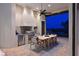 Outdoor kitchen and dining area with stainless steel appliances and serene views at 11807 Rive Isle Run, Parrish, FL 34219