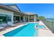 Backyard pool and spa with outdoor kitchen and relaxing patio area at 11807 Rive Isle Run, Parrish, FL 34219